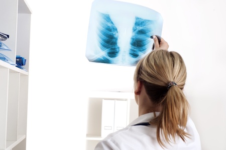 Female medic looking at x-rays