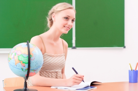 young teacher in the classroomの写真素材