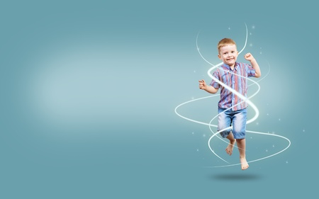 boy jumping hands up, collage, place for textの写真素材