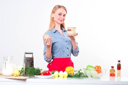 portrait beautiful woman cooking vegetables, healthy lifestyleの写真素材