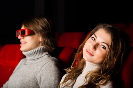 young couple in the cinema to enjoy the movieの写真素材
