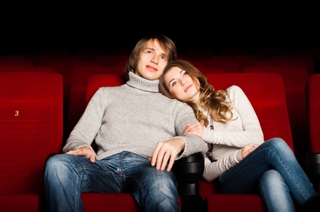 young couple in the cinema to enjoy the movieの写真素材