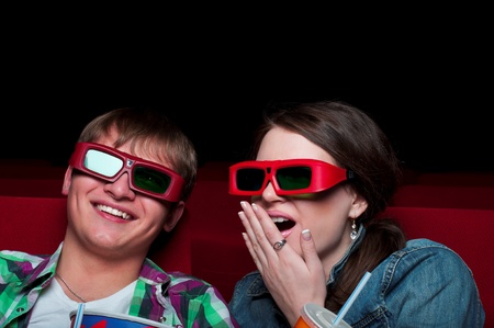couple in a movie theater, watching a 3D movieの写真素材