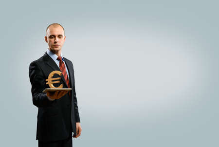 man holding tablet with euro symbol, money conceptの写真素材