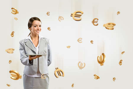 attractive business woman holding a tablet, financial conceptの写真素材