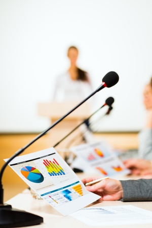 close-up microphone, on the background of business communication at the conferenceの写真素材
