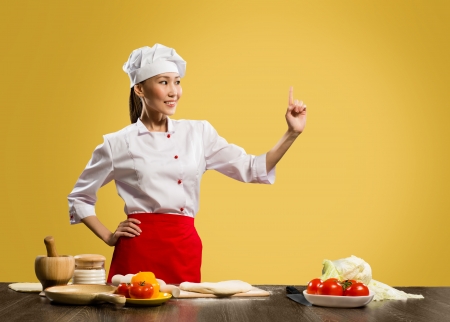 Asian female chef shows up on the place for textの写真素材