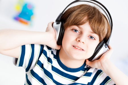 boy in headphones enjoys music, Keep your hands on the headphonesの写真素材