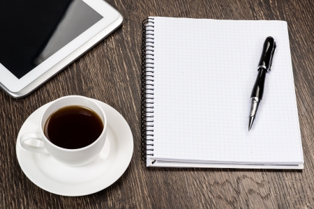 notepad, pen, coffee and tablet, workplace businessmanの写真素材