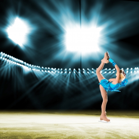 young skater performs on the ice in the background lights lighting young skater performs on the ice in the background lights lighting