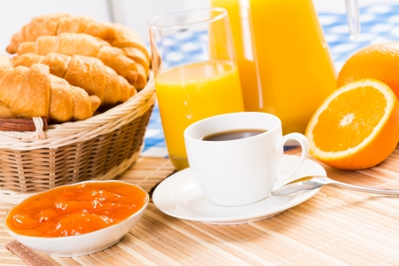continental breakfast  coffee, strawberry, croissant and juiceの写真素材