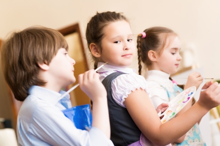 children paint easels for a lesson in the art schoolの写真素材
