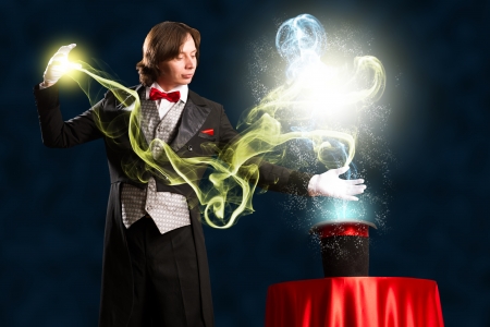 magician makes passes at the cylinder, the cylinder produces magicの写真素材