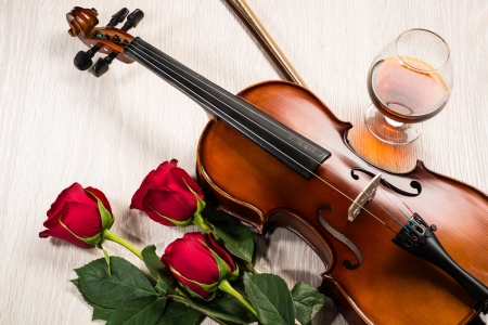 Violin, rose, glass of champagne and music books, still lifeの写真素材