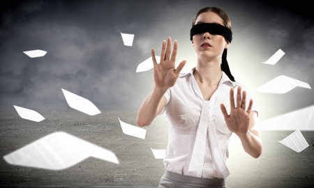 young blindfolded woman  can not find a way outの写真素材