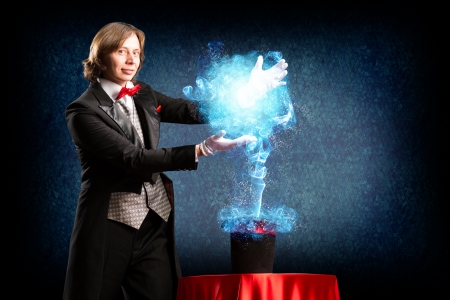 magician makes passes at the cylinder, the cylinder produces magicの写真素材