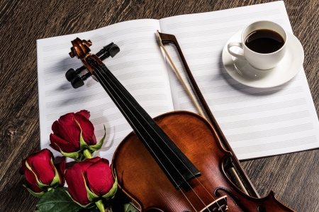 Violin, rose, cup of coffee and music books, still lifeの写真素材