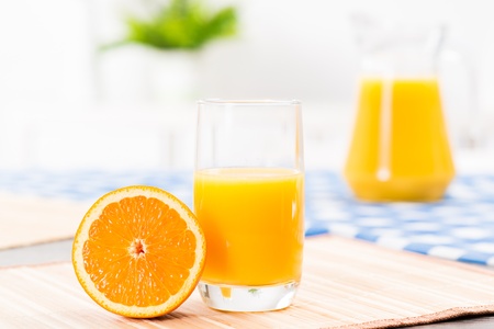 orange and a glass of orange juice, still life