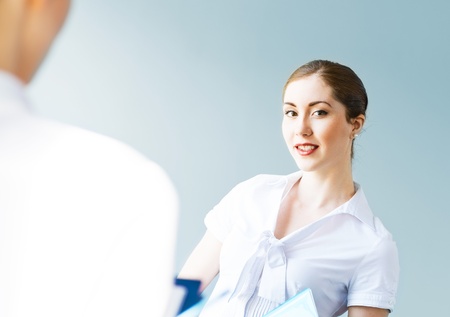 Young business woman talking with a colleague, interviewsの写真素材