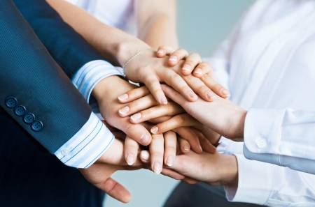 concept of teamwork  business people joined hands