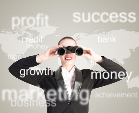 business woman looking through binoculars, concept search solutions in businessの写真素材