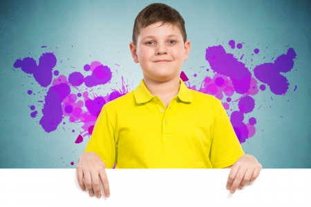 boy holding a white banner  place for textの写真素材