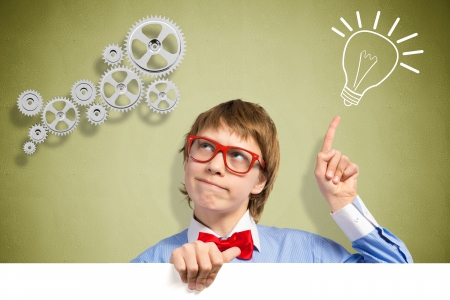 boy holding a white banner  place for textの写真素材