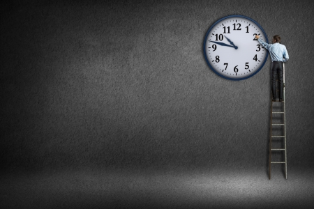 businessman clock painted on the wall, time is moneyの写真素材