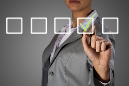 business woman making a mark, making choiceの写真素材