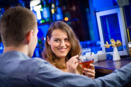 portrait of a young woman in a barの写真素材