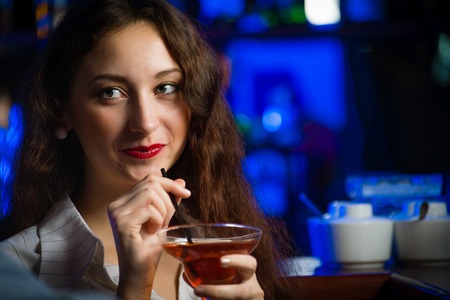 portrait of a young woman in a barの写真素材