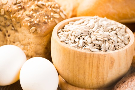 Fresh bread, eggs and grains  cook fresh bread at homeの写真素材