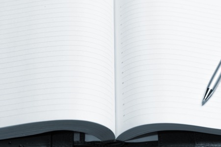 pen and open notepad, business still life