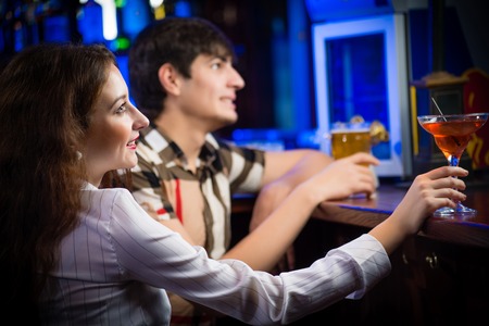 close-up portrait of a young woman in a barの写真素材