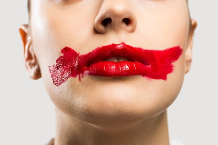close-up of a female vivid red mouthの写真素材