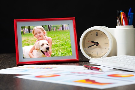 photo frame, business paper with growth graph, table clocks and keyboard  Workplace of the businessman の写真素材