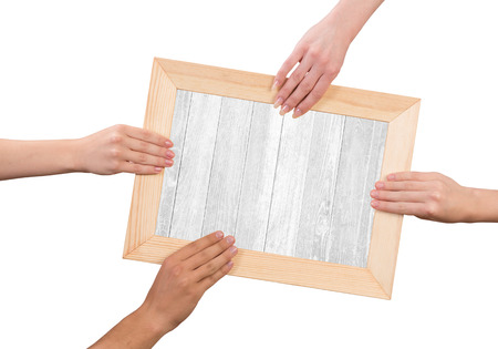 Close up of human hands holding wooden frameの写真素材