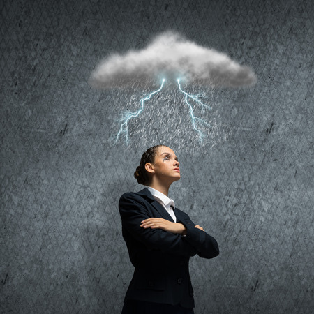 Young upset businesswoman with tears in eyesの写真素材