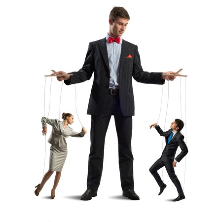 puppeteer keeps business people puppets, concept control businessの写真素材