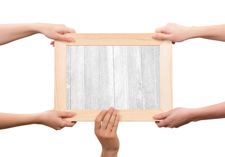 Close up of human hands holding wooden frameの写真素材