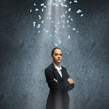 Young upset businesswoman with tears in eyesの写真素材