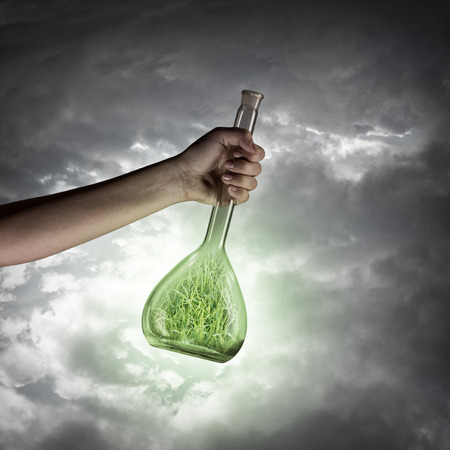 Close up of human hand holding test tubeの写真素材