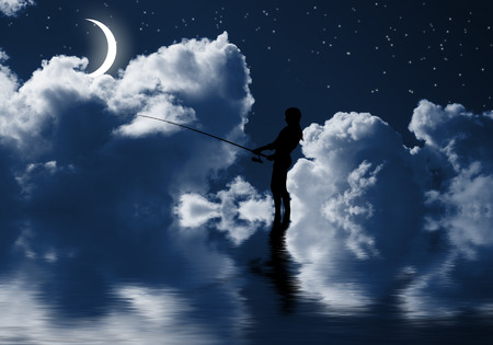 Silhouette of teenager girl fishing at nightの写真素材