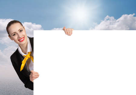 Young pretty woman with white blank bannerの写真素材