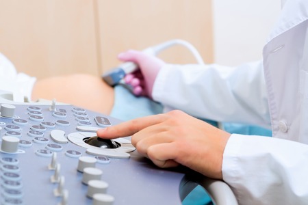 hand and abdominal ultrasound scanner for pregnant womenの写真素材