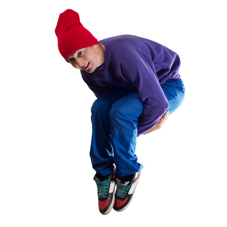 Young pretty boy dancer in jump isolated on white