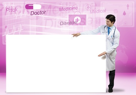 Young handsome doctor with white blank banner. Place your textの写真素材