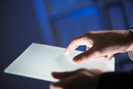 Close up of businessman hand touching Tablet screenの写真素材