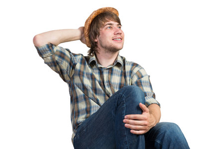 Young thoughtful guy in casual isolated on white backgroundの写真素材