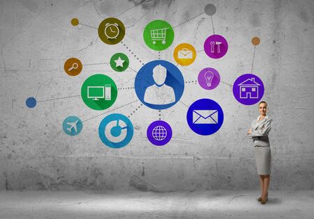 Businesswoman and color application icons at backgroundの写真素材